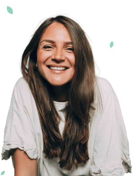 A female wearing a white shirt who is smiling