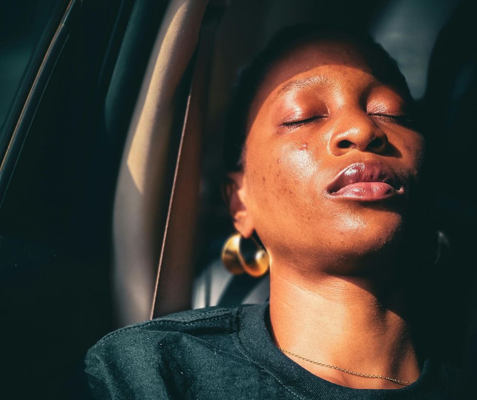 A black woman with her eyes closed